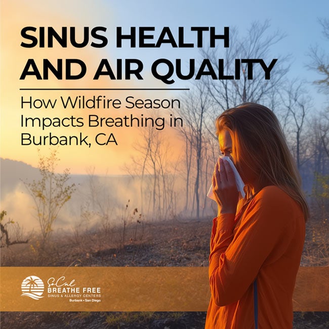 Woman in a forest during wildfire season, using a tissue to cover her nose