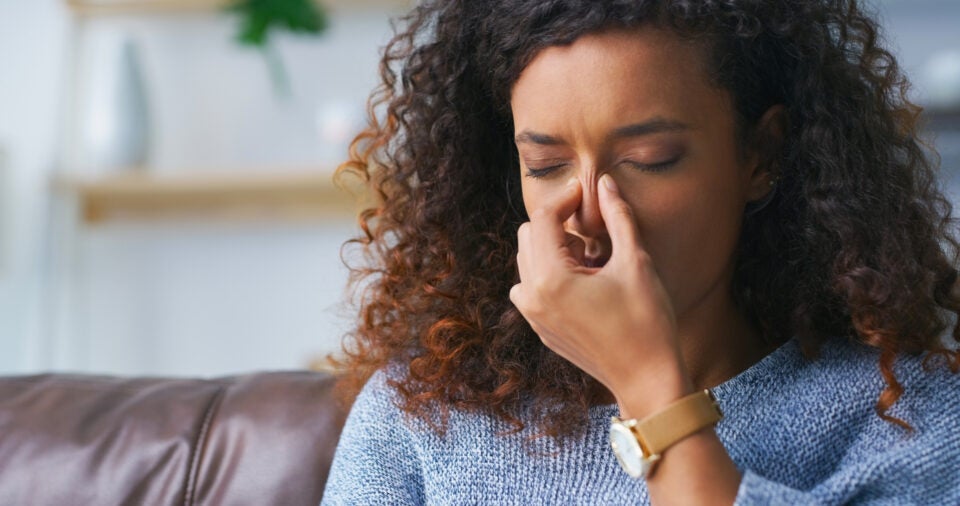 A person experiencing a blocked nose symptom in Burbank, CA